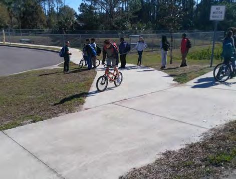 Bicycle and Pedestrian Safety Review School Campus: The school campus has one entrance on Belle Terre Parkway; the drop-off and pick-up queue path snakes through the front of campus,