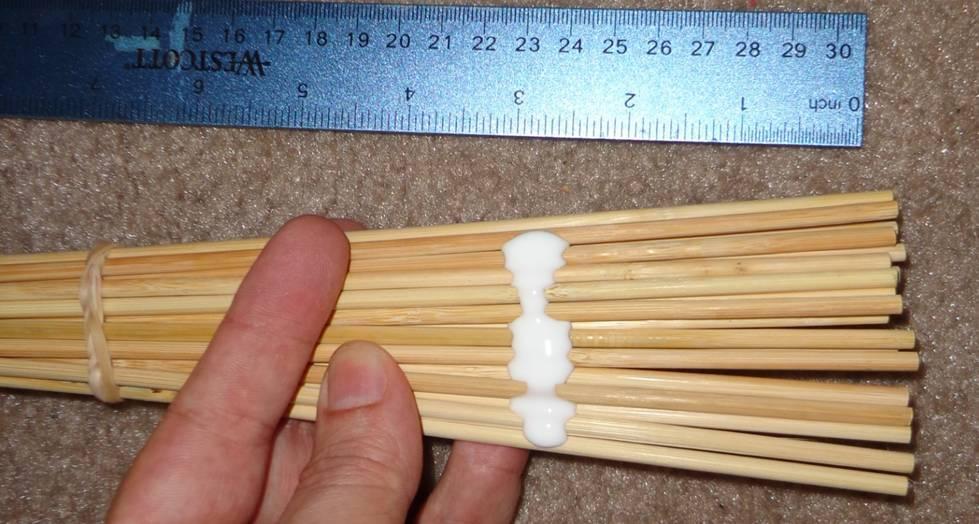 o Tap rod bundle on table so ends line up at handle end Add second rubber band about 1 from handle end Rods should form a hexagon (6 flat sides of 3 rods per side).
