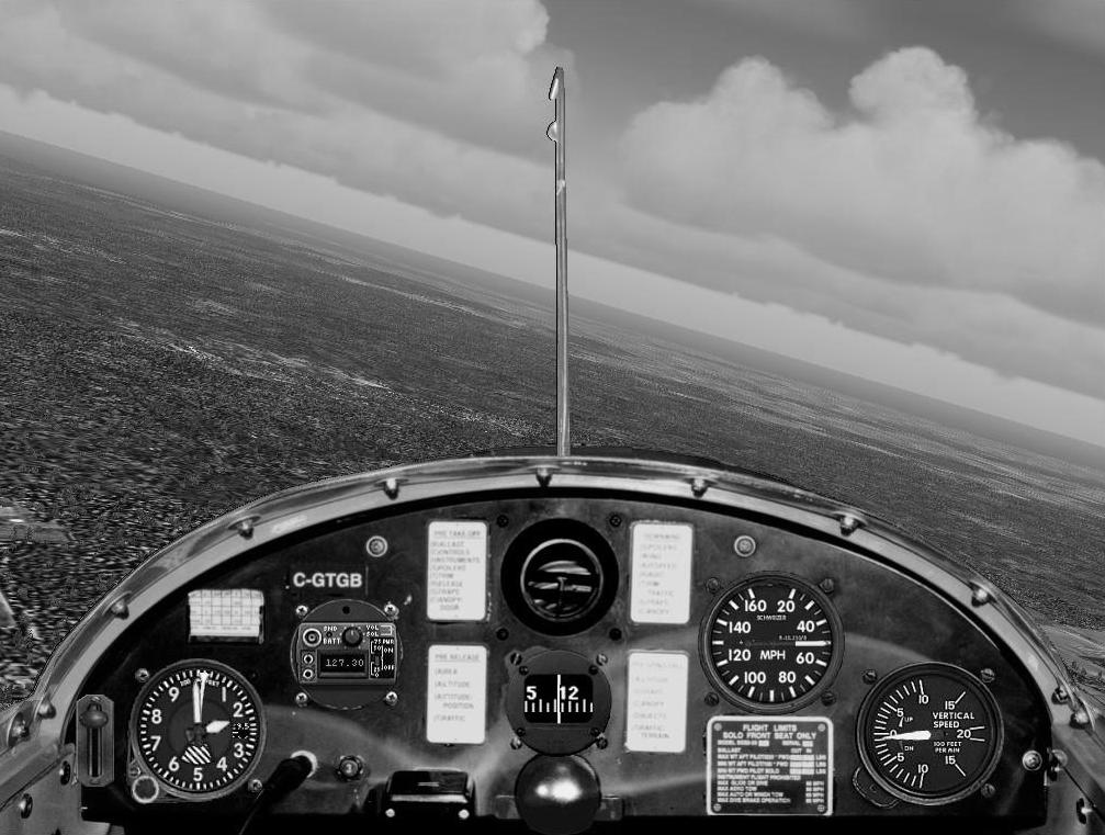 Note bank angle - estimate by comparing the bottom of the instrument panel and pitot tube to the horizon Yaw string does not appear in picture because directly behind pitot tube (coordinated turn)