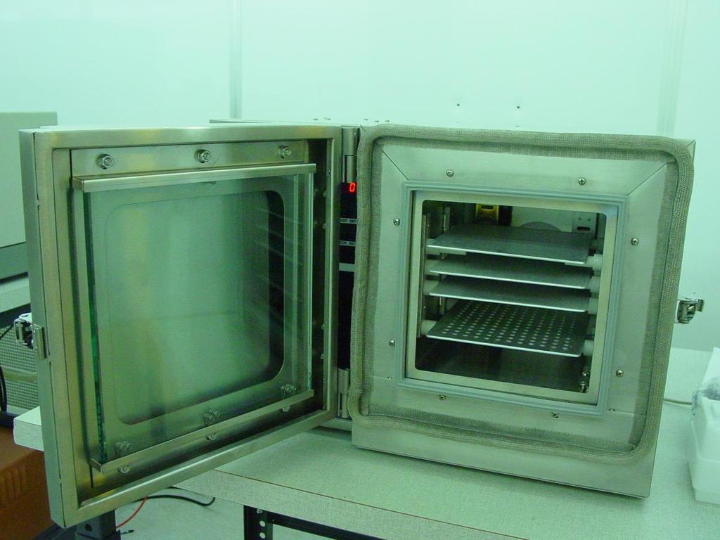 Figure 1. March Asher plasma reaction chamber showing the thin aluminum shelves sitting on ceramic posts emanating from the walls.