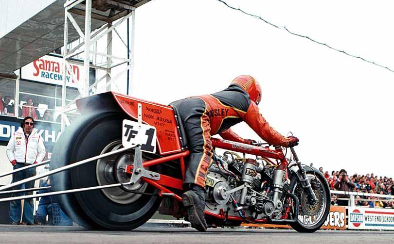 American influence Marion Owens, from Oklahoma City, astride his huge twinengined Harley Davidson on the Santa Pod start rollers.
