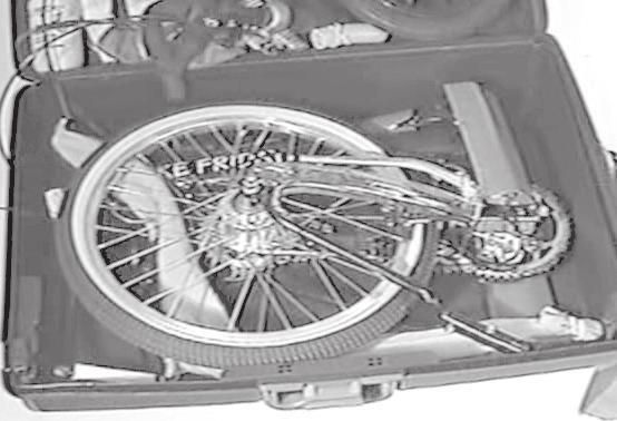 You will have to partially lift out the bike to accomplish this. Note that the long section is in the bottom front of the case, under Fig. 16 Trailer tongue placement. the rear wheel.