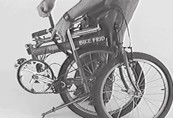Unwrap the strap and then thread it over the handlebar, around the mono-tube, through the rear wheel, and back up again to the buckle. This Fig. 11 Seat mast strap.