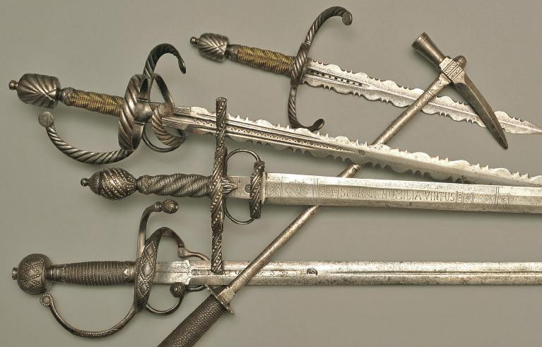 Rapier and dagger set, German around 1600. Pierced blades with scalloped edges, rapier blade with negro-head marking, guards with filed ornamentation. Riding sword, German dated 1609.
