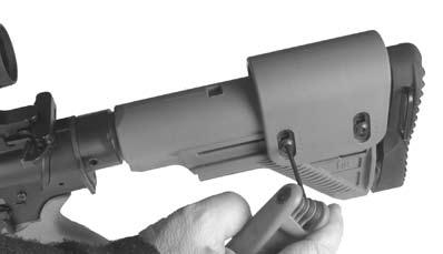 The buttstock must first be completely removed from the receiver extension by pivoting downwards on the front of the release lever while simultaneously sliding the stock off the extension. Fig.