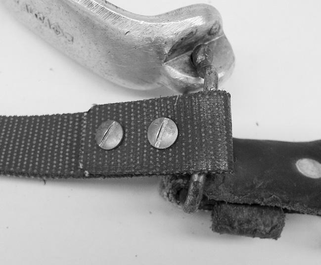 The buckle should be toward the front of the shank. (A) 5. Completely thread the ring onto the shank. 6. Repeat the procedure on the other shank. Installing 87N Bottom Straps 1.