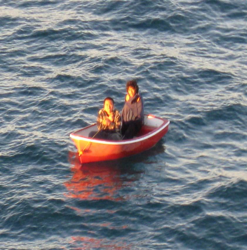 Figure 3 Both men inside the dinghy at the time of their rescue 14. At about 1930 hours the skipper and his nephew drove from their home address to the Tukituki River Estuary with the dinghy.