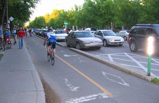 Bicycle movement in both directions on one side of road Raised or street