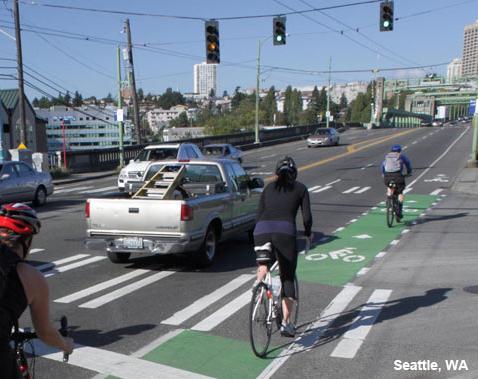 Pavement markings through intersection Guide bicycles Increase visibility for