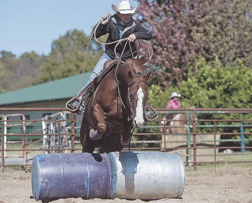 Joplin woman preps for world championship in extreme cowboy racing Annie Chance makes a jump on her horse Hot Rod Whiz at her training ranch in