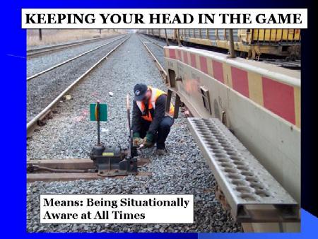 on the track Do not walk between the rails or along tracks (devil s strip) Watch for moving equipment on tracks when approaching,