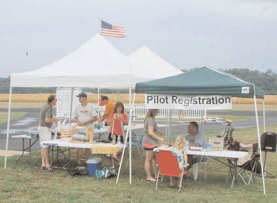 FLIGHT LINES The pilot registration and raffle tents at the August 4 Electric Fly-In were very busy.