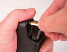 DO NOT ATTEMPT TO LOAD THE MAGAZINE WITH MORE THAN THE SPECIFIED NUMBER OF CARTRIDGES BECAUSE DOING SO MAY CAUSE A FAILURE TO FEED A ROUND OF AMMUNITION INTO THE CHAMBER.