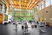 conditioning training area that overlooks the playing courts, a large theater-style team meeting room, three spacious