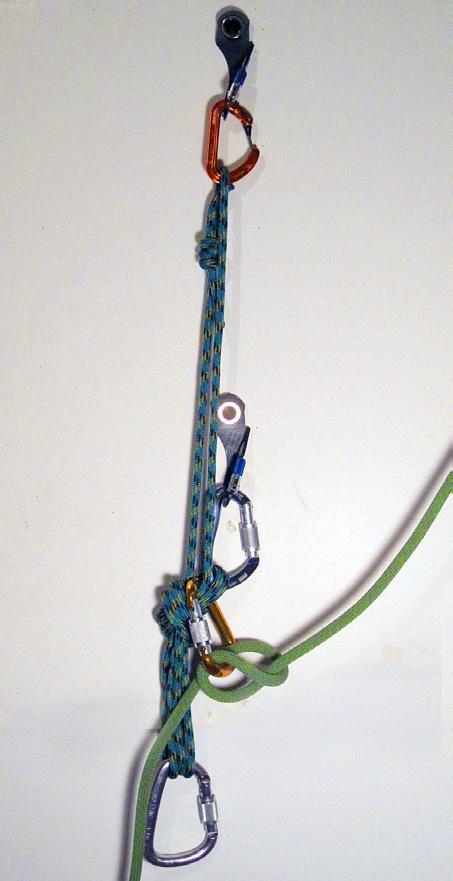 carabiner clipped to fixed-point loop as well as shelf to