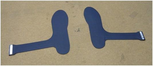 image of plantar loading. Several commercial products exist including floor-based systems and portable instrumented insoles, shown in Figure 1.13. A B Figure 1.