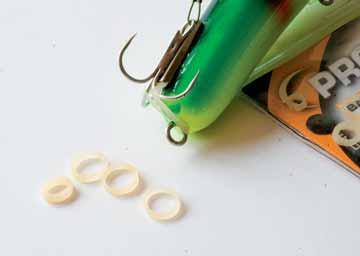 On wire I use a segment from a ball chain inside the knot. Micro Hook Beads like these from Kevin Nash are perfect to protect the knot.