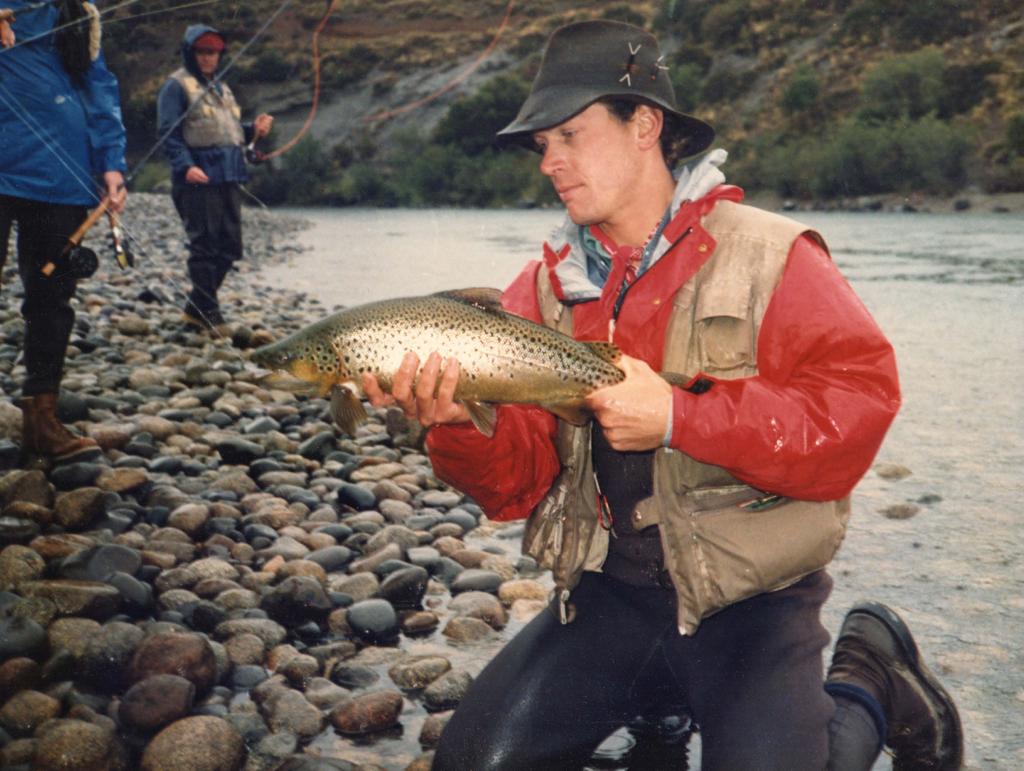 Bob holding a brown at the Boca of the Chimehuin, circa 1985.