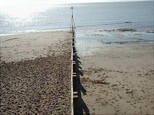 to build up the beach Describe and explain how longshore drift moves beach material