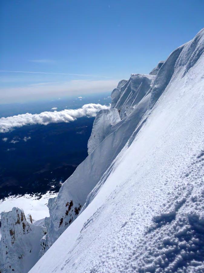 The north slopes of Mt. Hood from the summit ridge. The summit is the highest point in the distance, following a five minute, very attention- grabbing traverse.