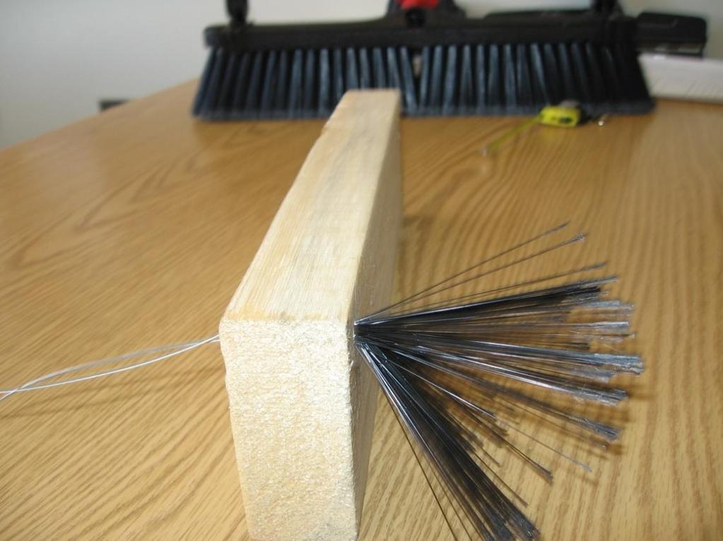 2) Thread the steel wire around the bristle, remove the
