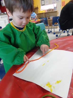 By using different paint colours, this allowed the child to see the impressions on the paper that each different size of string made.