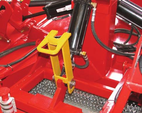 Section 3 - Mower Preparation 6. Remove the Height Control Transport Lock - Raise the mower center section by extending the lift cylinder. - Shut off the tractor and remove the ignition key.