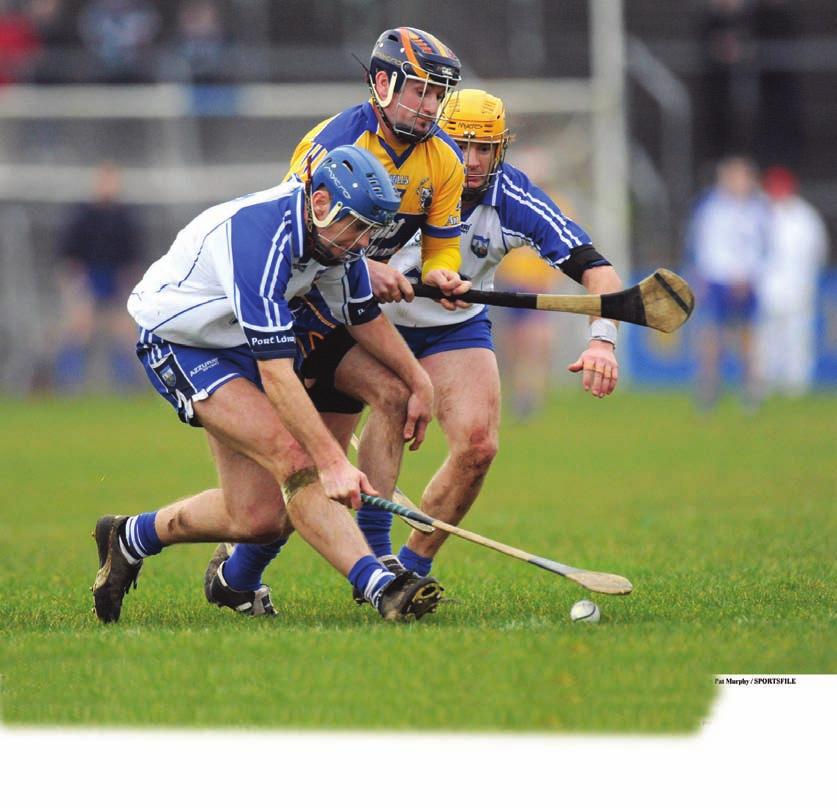 Roll the sliotar towards the body and slide the toe of the Hurley underneath to lift it.