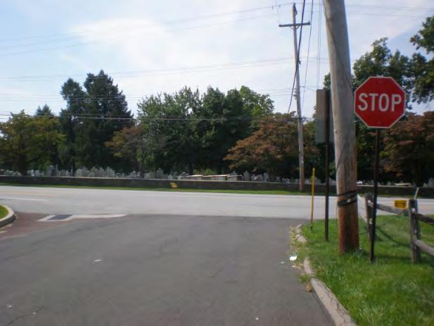 Use pavement striping to define travel lanes on Clearfield Avenue in the vicinity of the intersection. Use signage and pavement markings to keep the intersection box clear.
