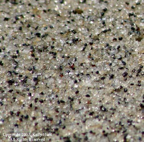 Beach sand varies from place to place, and can be made up of many things from coral to volcanic lava to rocks.