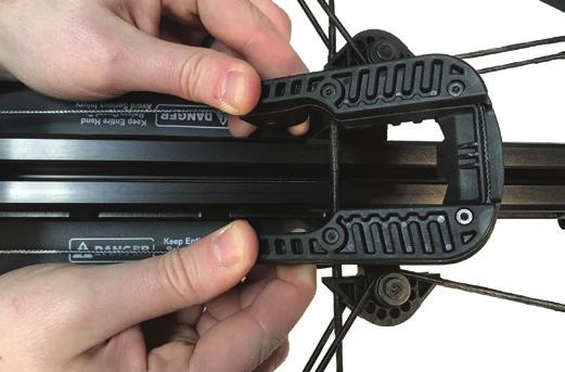 If your crossbow is equipped with a standard claw holder (horizontally mounted behind trigger box), relieve the string pressure on the claw by connecting the crank to the drive hex, applying a slight