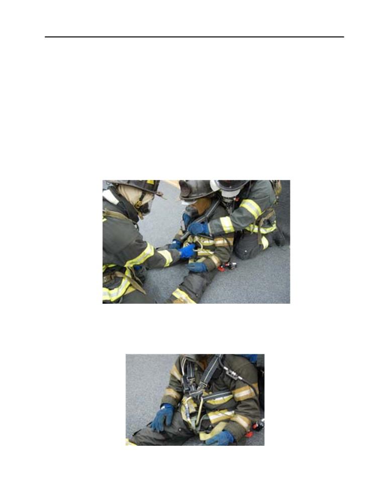 2.8 Rescuer 1 maintains the distressed member s SCBA cylinder as high as possible creating slack in all of the straps. 2.