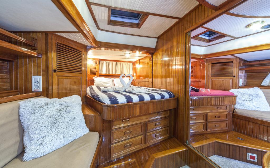Aft (view from starboard cabin) two mirror cabins with queen beds.