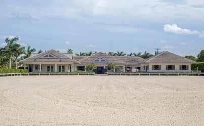 Additional equestrian features include a ¼ mile allweather track, eight oversized paddocks, a large storage garage, and a lunging arena.
