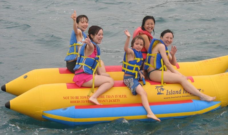 Sam on a banana boat during our Snorkeling Adventure with four Japanese tourists.