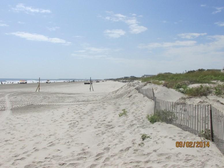 NJBPN 118-57 th Street, Sea Isle City The left photo (taken September 2, 2014 shows sand accumulating around the fencing at this site.