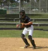 first baseman) straddling the plate in a good