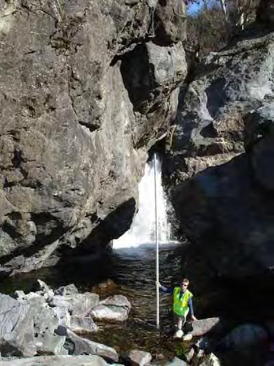 (a) (b) Fifteen-foot-high waterfall in the landslide reach of Arroyo Hondo, (a) on February 23, 2006 with flow