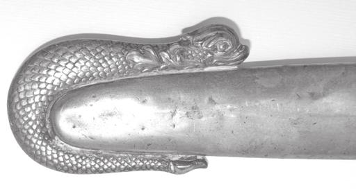 The drag tip is in the shape of a dolphin. During this period of American history the Navy went Figure 42. (Sword 12) Figureeight knot on scabbard.