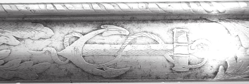 The grip is made of carved ivory. The blade is etched with a fouled anchor over Tecumseh holding a tomahawk, with an eagle marked Liberty, thirteen stars and a sunburst.