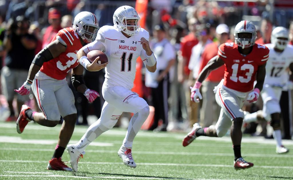 DESPITE STRONG START, TERPS FALL AT #1 OHIO STATE COLUMBUS, Ohio - Perry Hills set a new program quarterback record with 170 rushing yards but the Maryland football team fell, 49-28, to No.