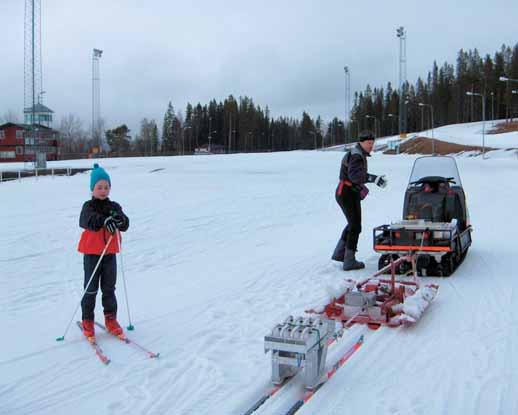 friction The special-purpose setup for measuring ski gliding friction under different loads is pulled by snowmobile.