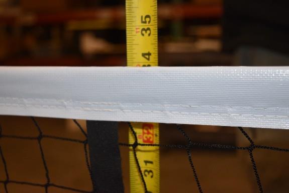 Measure the net height in the center and adjust the Velcro if needed to achieve the needed 34 from the ground to the top of the center of the net.