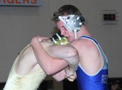 championship, and senior Robbie Miller (125) added his first as