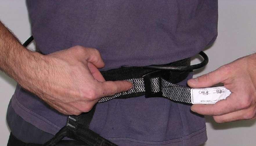 Demonstrate how to double back through the buckle. Doubling back helps ensure buckle will not come open.