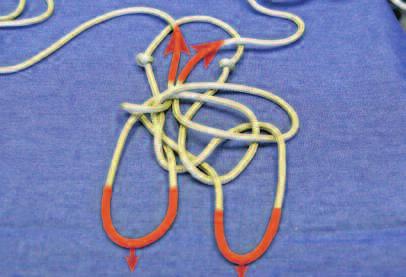 Moving to the left-hand side, anchor your knot and take the left strand of rope and put it over the left loop and then pull it all the way through the