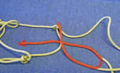 Take the piece of rope loop you just created and through the and go under and pull it