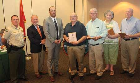4 Four Decatur County residents were honored at the September meeting of the Tennessee Fish and Wildlife Commission for
