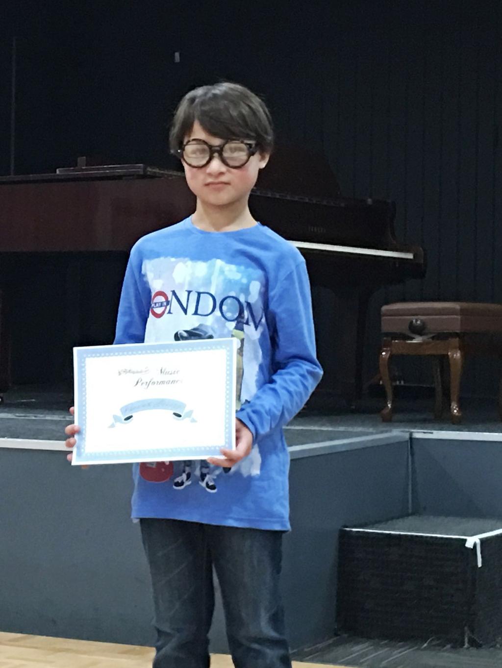 It is always great to see what our swimmers do outside of swimming- thank you Emilia for sharing this photo of Phoenix with his piano Performance Award at Macarthur Performing Art Clubs last Sunday.