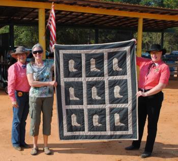 22 caliber revolver and SASS has donated flags, books, and gun rugs. And let us not forget the two quilts, shown to the left and right.
